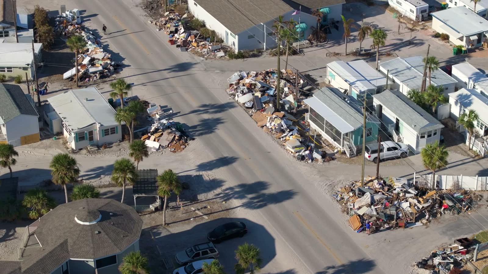 A house roof stripped of shingles by hurricane-force wind, the damage behind a denied Destin, FL wind damage insurance claim
