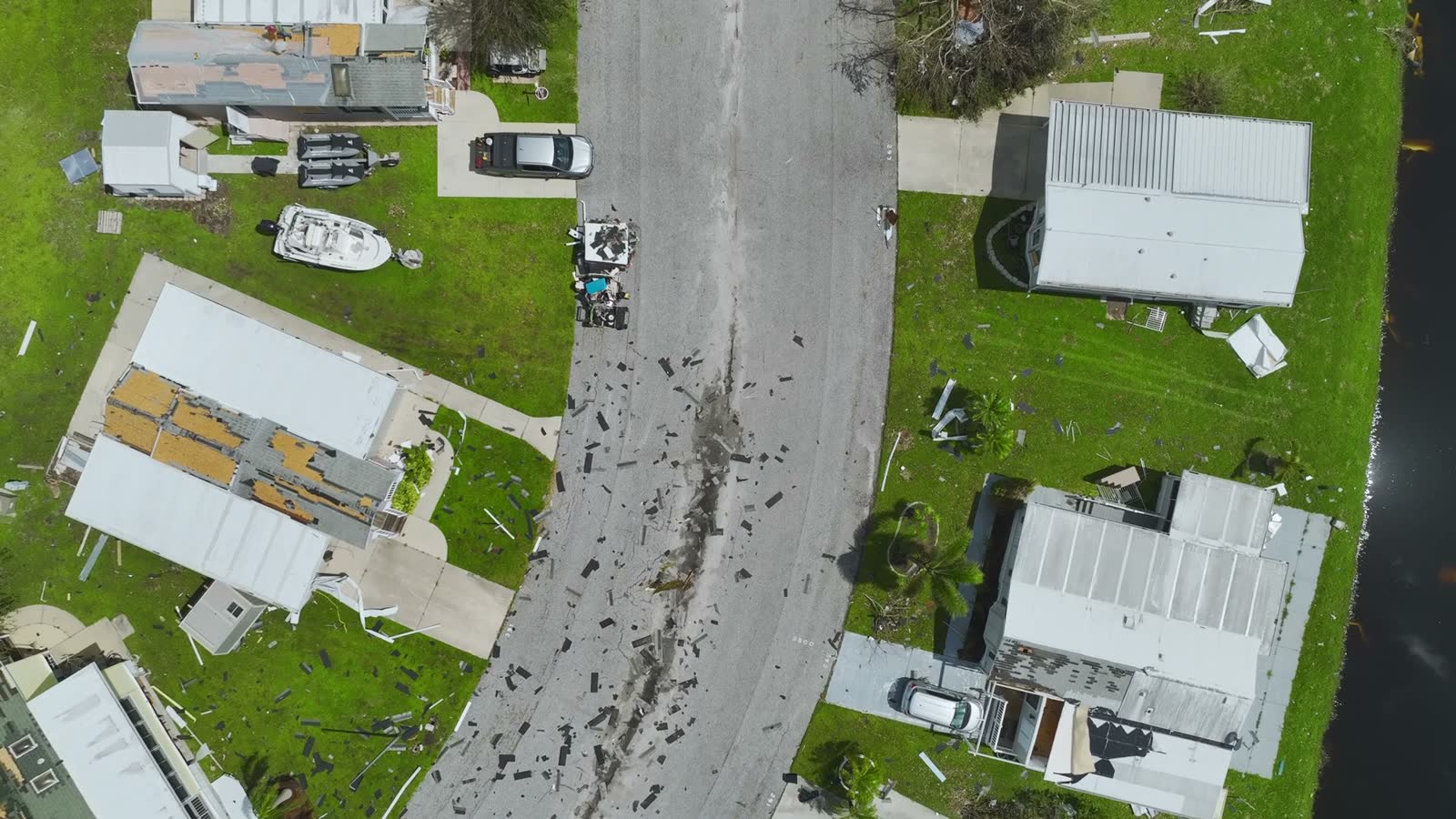 A row of hurricane-damaged houses, the point in a claim where adjusting stops and a legal fight begins