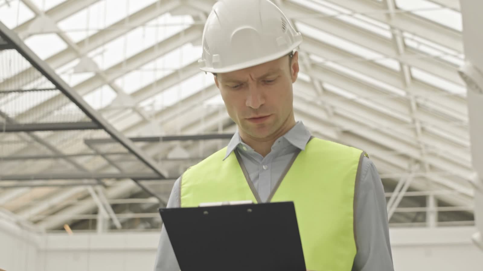 commercial-property-claim-construction-worker-inspects-clipboard.mp4