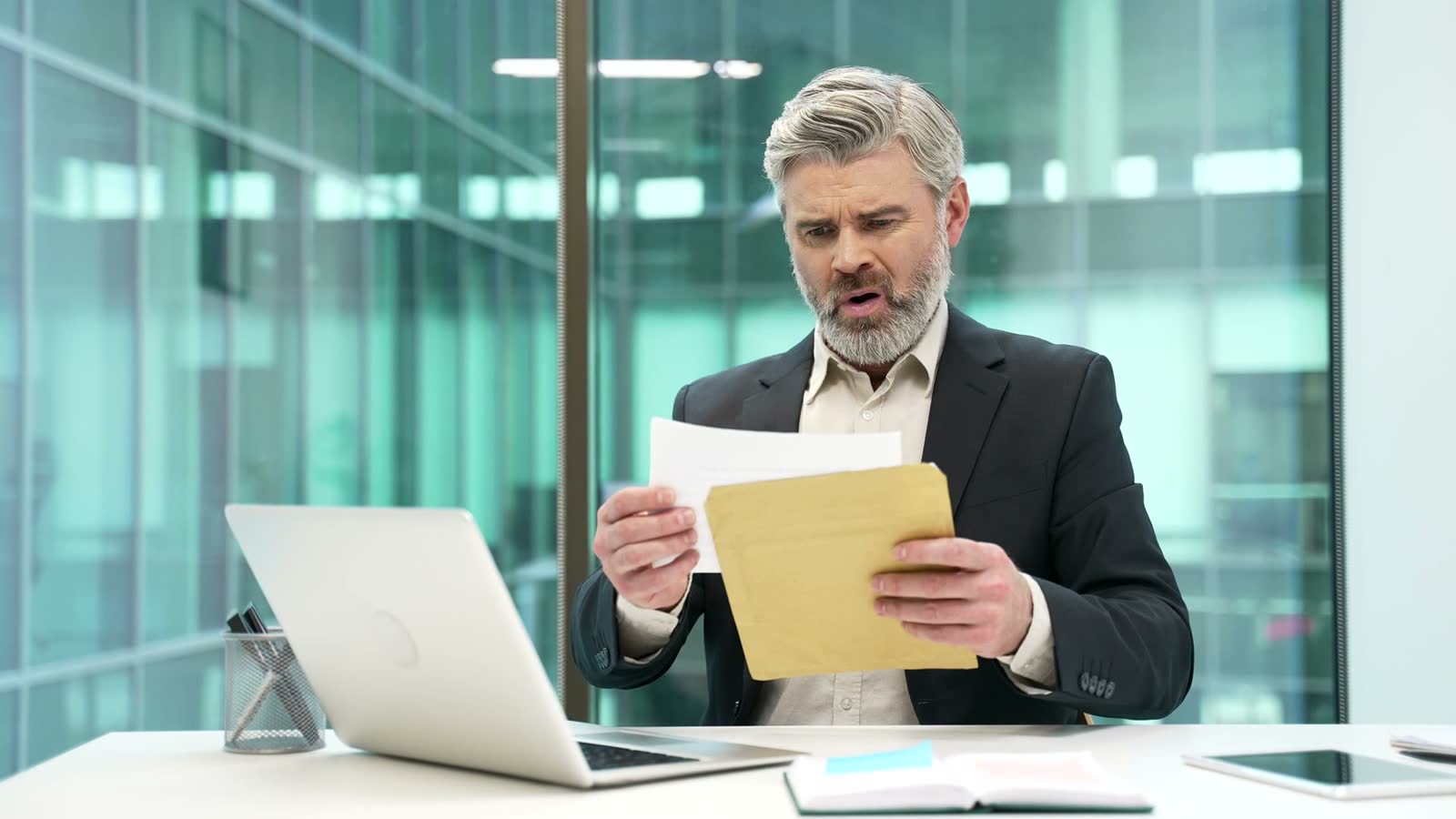 property-insurance-claim-concerned-mature-man-reads-documents.mp4