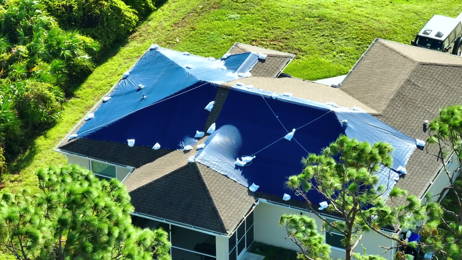 Water staining spreading across an interior ceiling and walls, the damage behind a denied Sarasota, FL water damage insurance claim