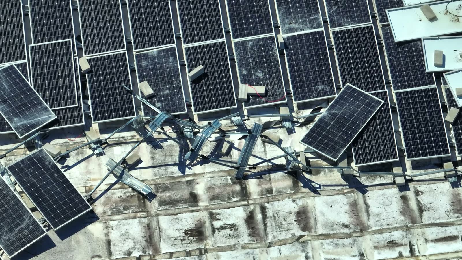 A house roof stripped of shingles by hurricane-force wind, the damage behind a denied Crestview, FL wind damage insurance claim
