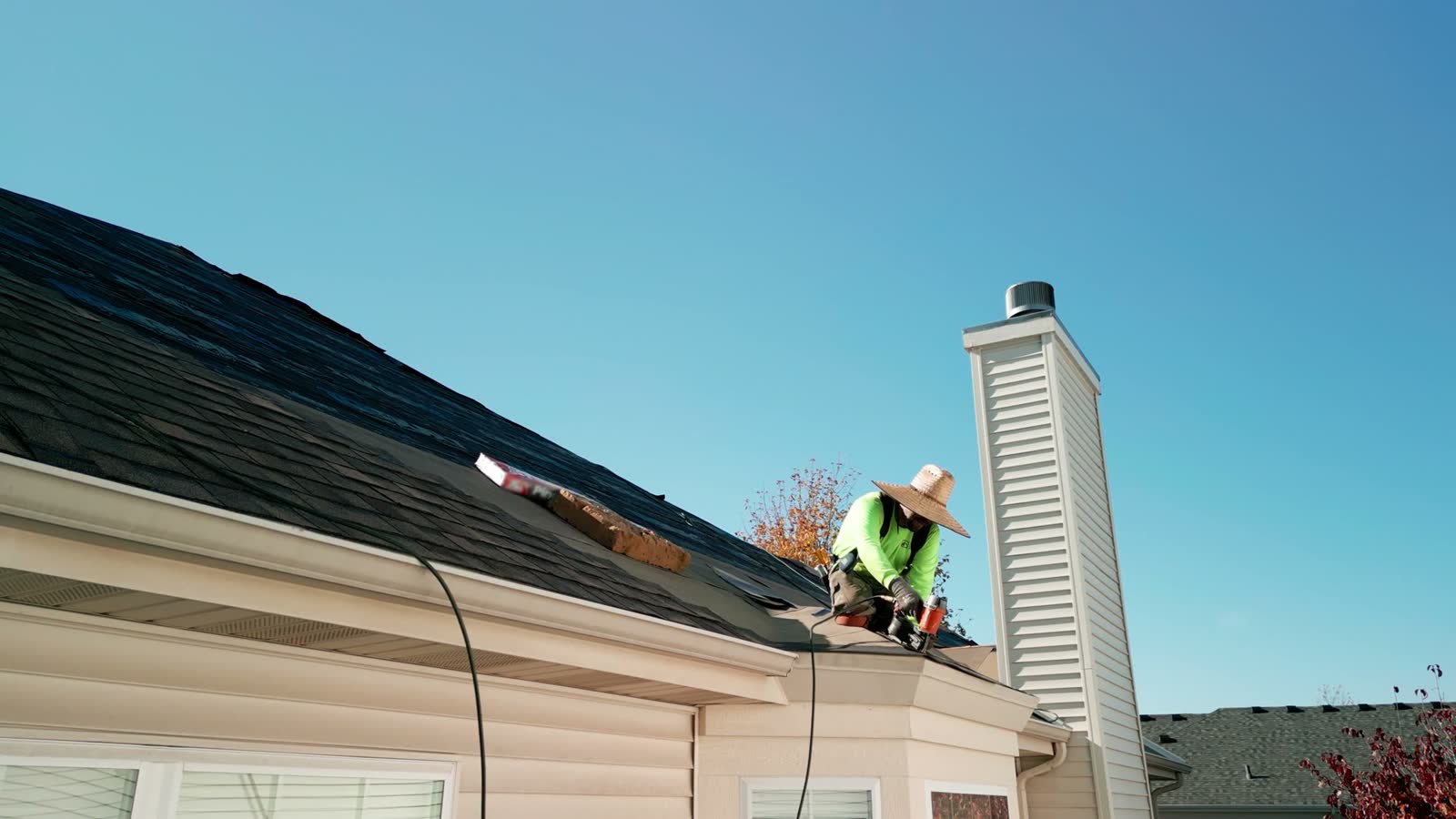 roof-damage-claim-adult-roofing-suburban-house-sunny-day.mp4