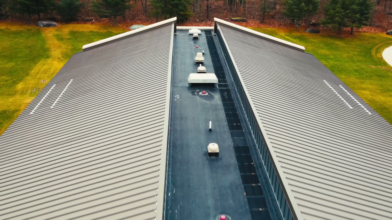 roof-damage-claim-aerial-drone-modern-school.mp4