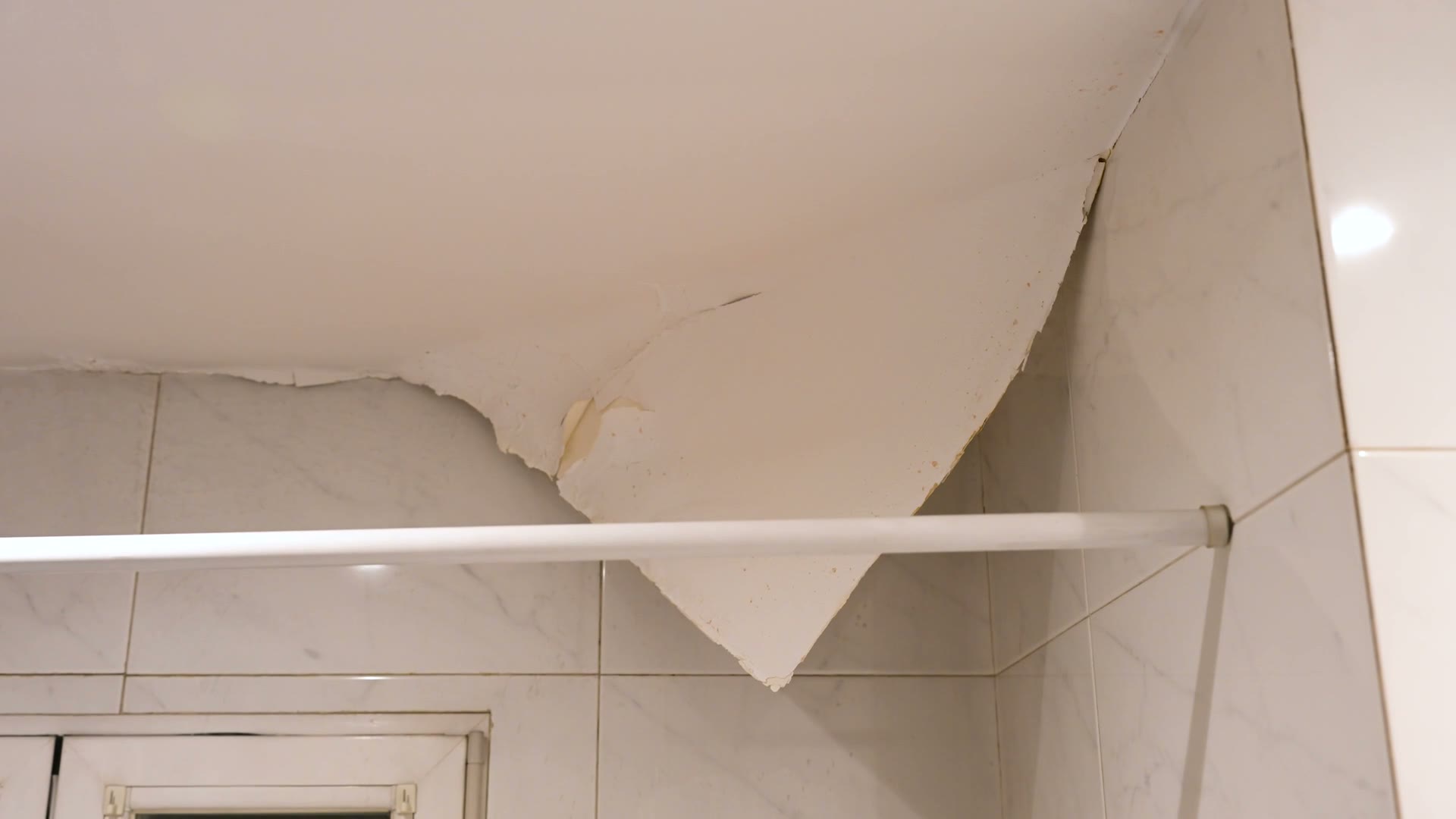 Wind-driven rain forced through a roof and into the ceiling below, the damage behind a denied Panama City Beach, FL wind-driven rain claim