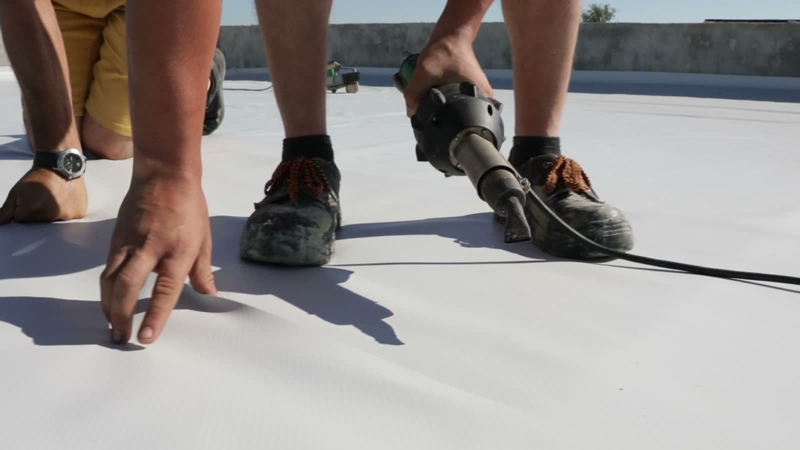 roof-damage-claim-roofers-use-heat-gun-light-grey.mp4