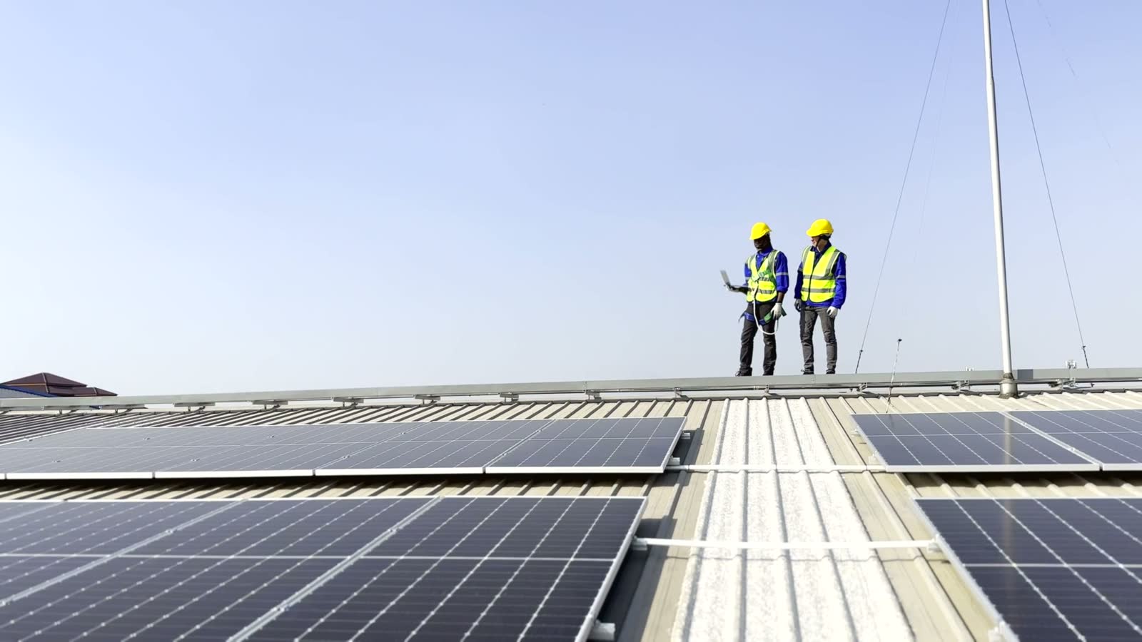 roof-damage-claim-two-engineers-inspecting-solar-panels.mp4
