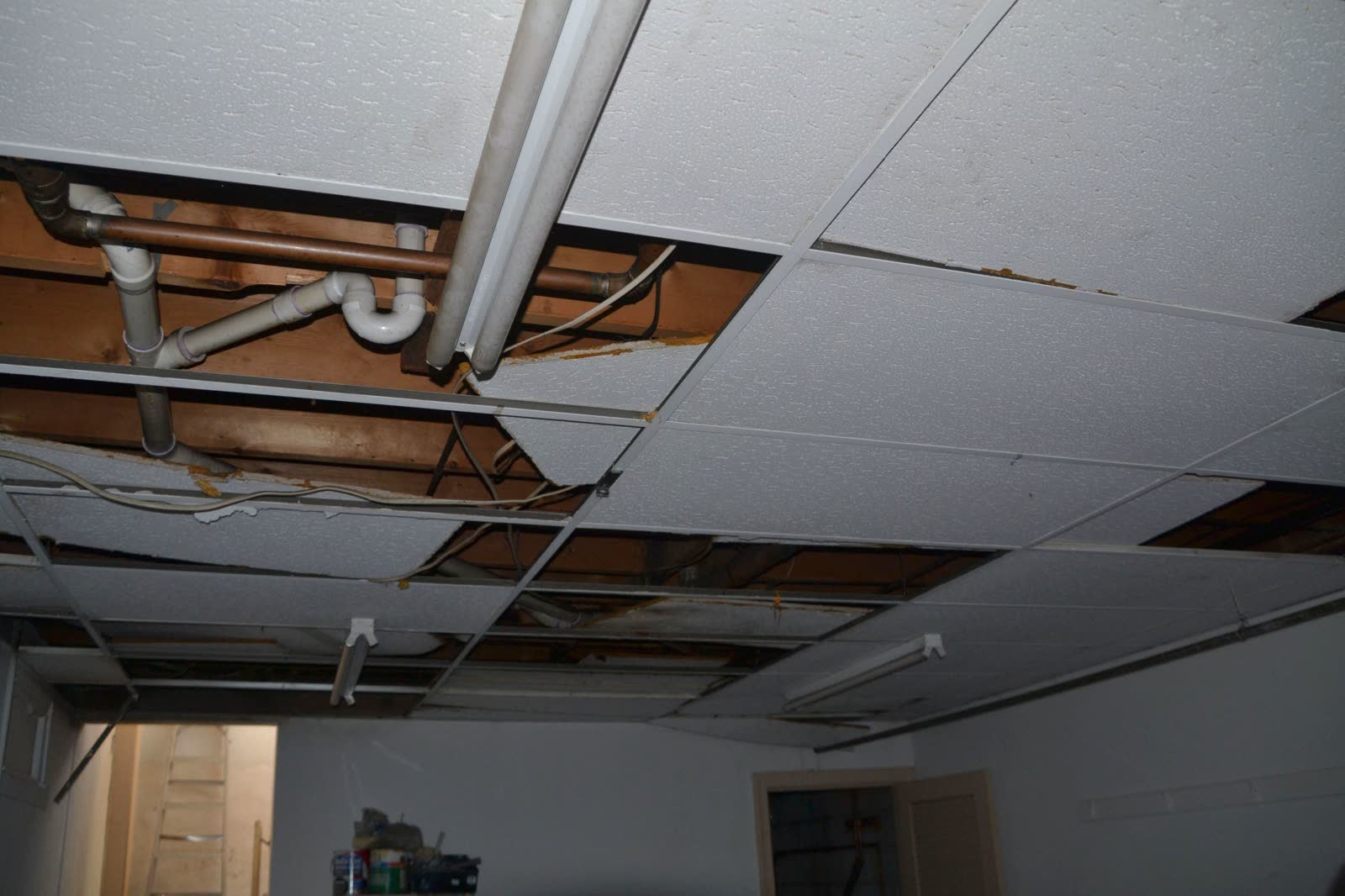 Water staining spreading across an interior ceiling and walls, the damage behind a denied Crestview, FL water damage insurance claim