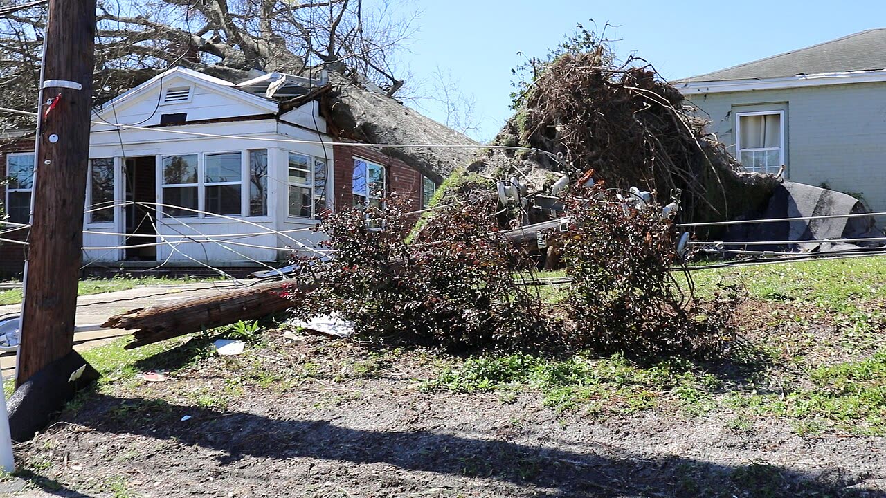 Wind damage in Panama City, miles inland from the surge zone, the roof-claim epicenter
