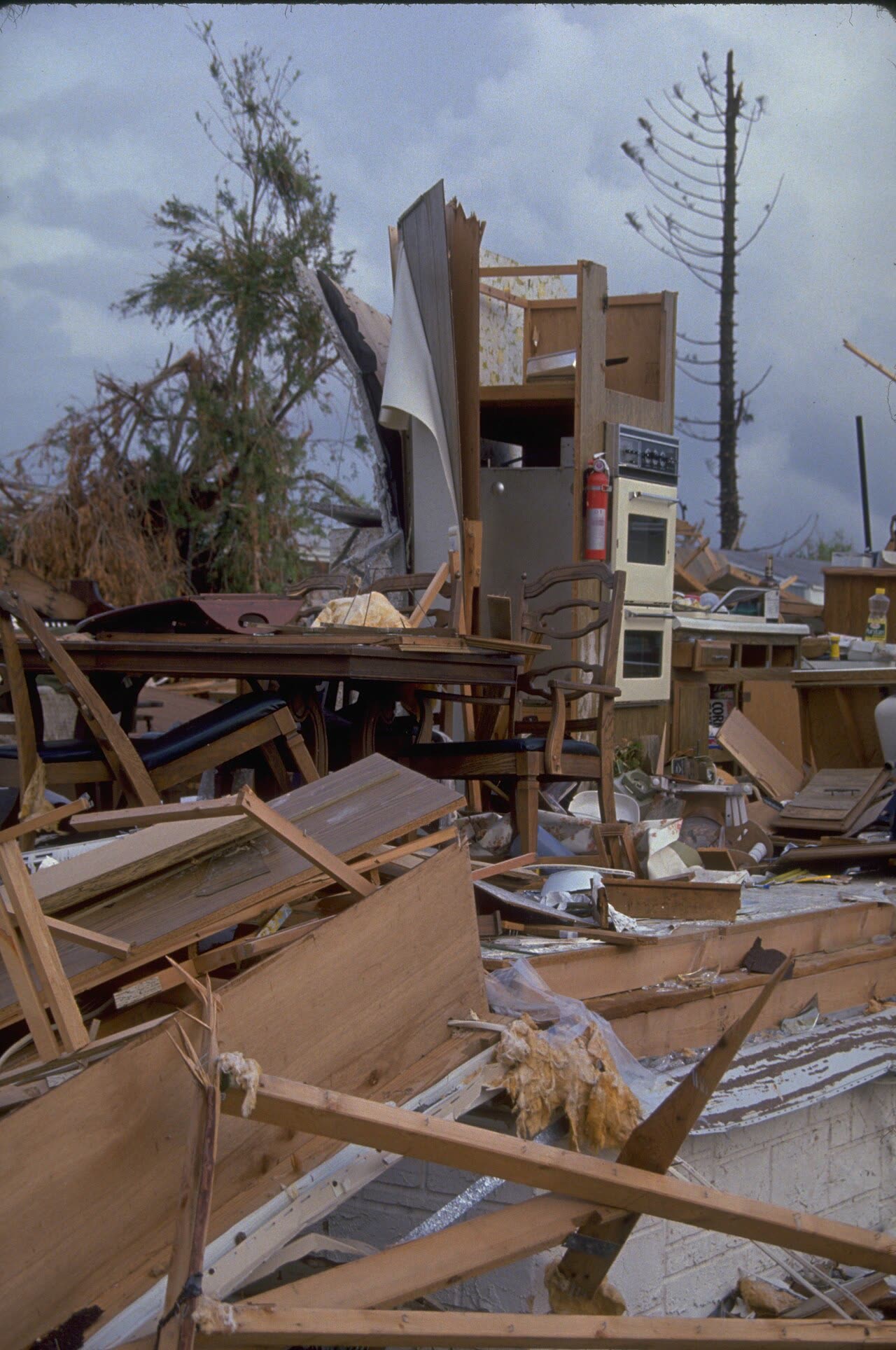 Wind-destroyed homes in the Homestead area, stapled roof sheathing failed first, then wind-driven rain gutted interiors
