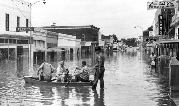 Boats in the streets of Live Oak, where Dora's rains put parts of town under deep freshwater flooding