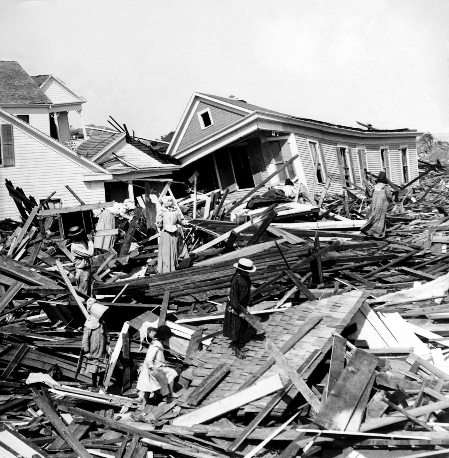 Residents searching the debris field, wreckage was piled in a ridge up to two stories high across the island
